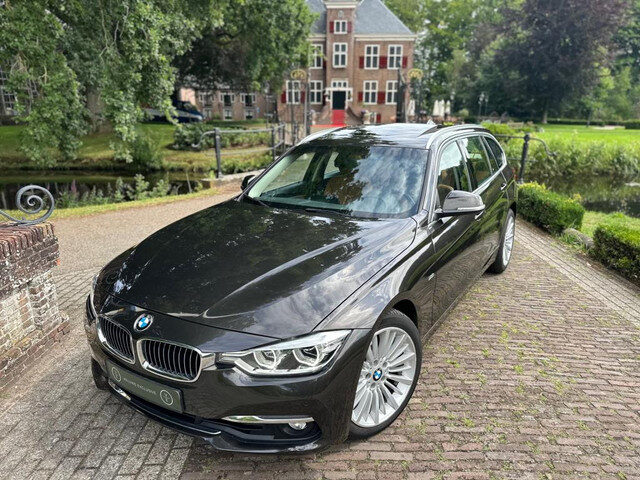 BMW 3 Serie touring 330i High Executive | Luxury | Pano | Leder |