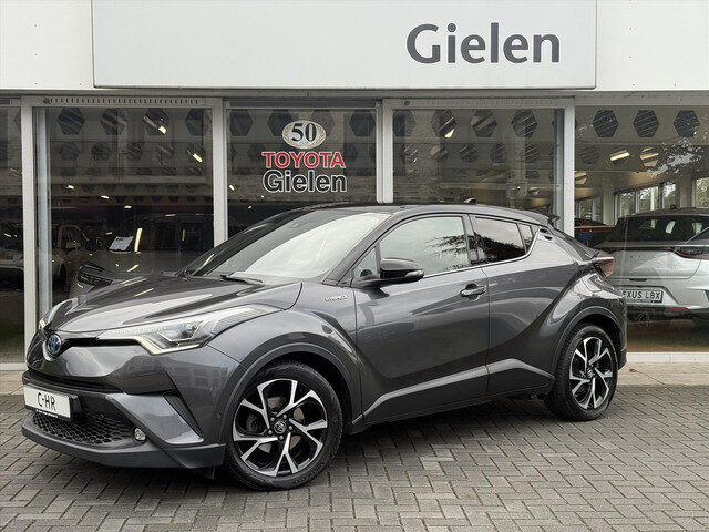 Toyota C-HR 1.8 Hybrid Bi-Tone Plus | Leer, Stoel + Stuurverwarming, Navigatie, Dodehoekherkenning,