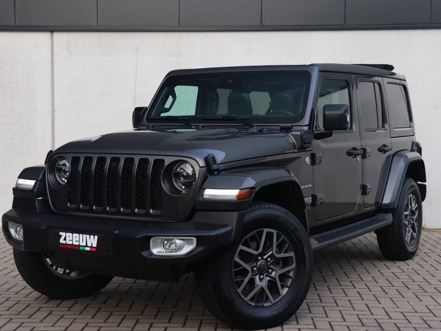 Jeep Wrangler Unlimited 4xe 380 PK Sahara | Leder | Soft Top | Camera | 18"