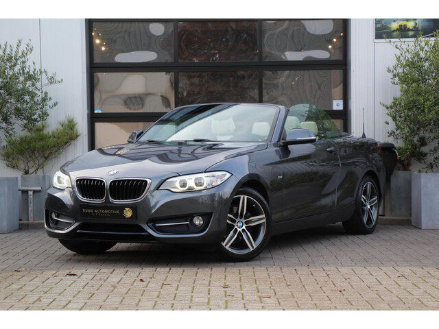 BMW 2 Serie Cabrio 218i Sportline - LEDER - NAVI - LED - PDC - STOEL VERW - ELEK KAP - CRUISE - DEAL