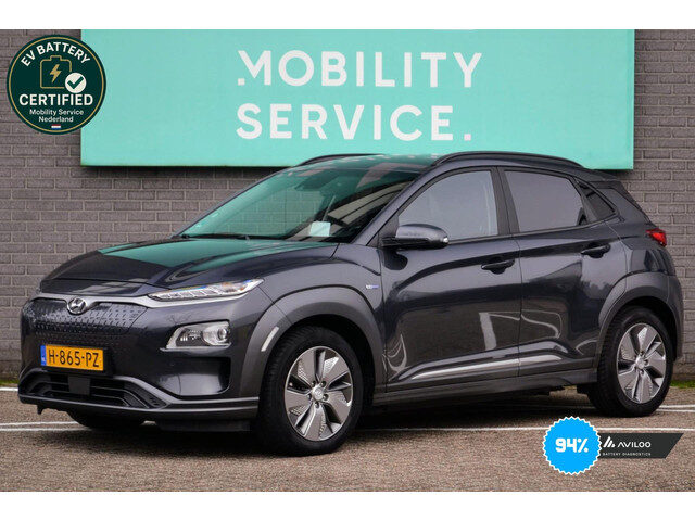Hyundai Kona EV Premium 64 kWh SOH94% Clima ACC CarPlay Leder Trekhaak LED Cam