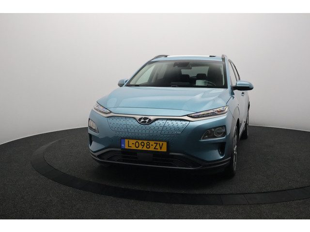 Hyundai Kona EV Fashion 64 kWh 3- Fase SOH 95,8% | Warmtepomp | Elektrisch Schuif/Kanteldak | Camera